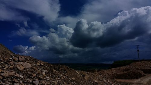 Scenic view of storm clouds over sea against sky