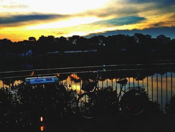 Cars on road at sunset