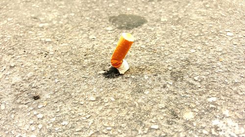 Close up of cigarette on ground