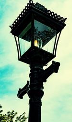 Low angle view of birdhouse against sky