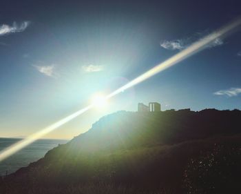 Sun shining over mountain