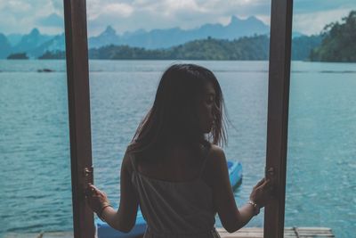 Rear view of woman looking at sea