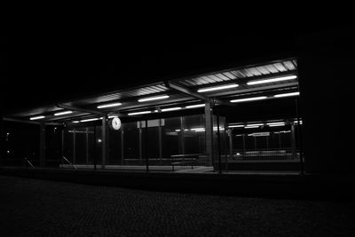 Illuminated railroad station at night