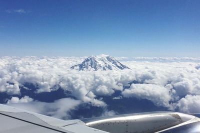 Aerial view of snowcapped mountains against sky