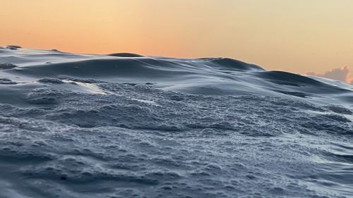 Scenic view of sea against clear sky during sunset
