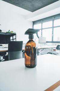 Close-up of glass bottle on table