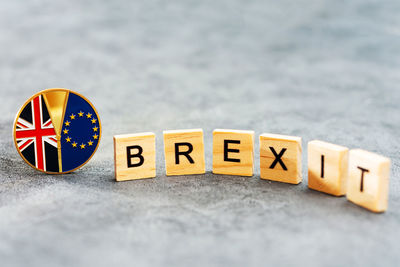 High angle view of wooden toy blocks with brexit text on table