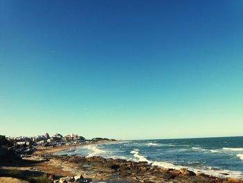 Scenic view of sea against clear blue sky