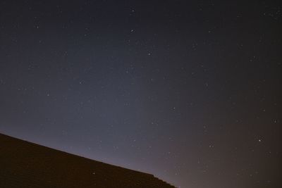 Low angle view of star field against sky at night