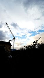 Low angle view of building against cloudy sky