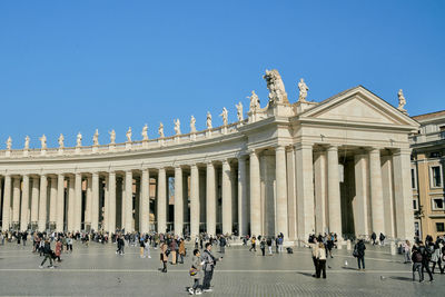 Group of people in front of historical building