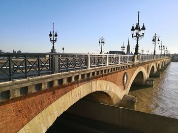 Pont de pierre in bordeaux against blue sky