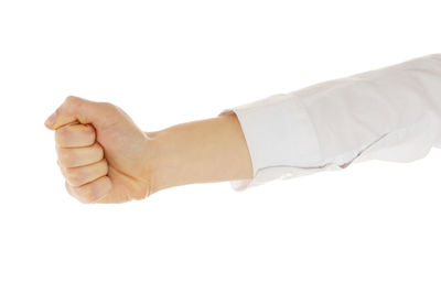Close-up of hands over white background