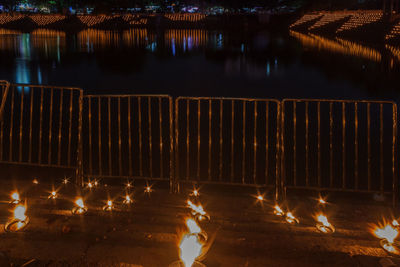 Illuminated fire in river at night