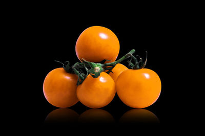 Close-up of oranges against black background