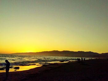 Scenic view of sea at sunset
