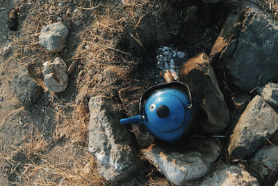 High angle view of teapot on field