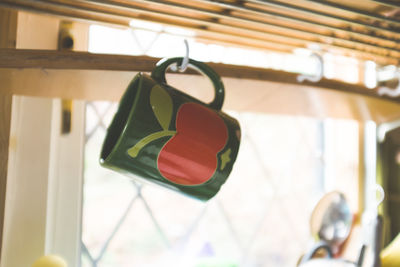 Close-up of bell hanging on metal