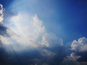 Low angle view of blue sky and clouds