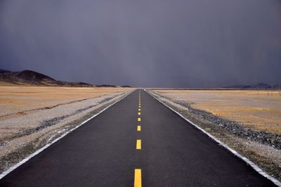 Empty road along landscape