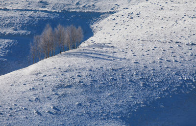 Frozen lake against sky during winter