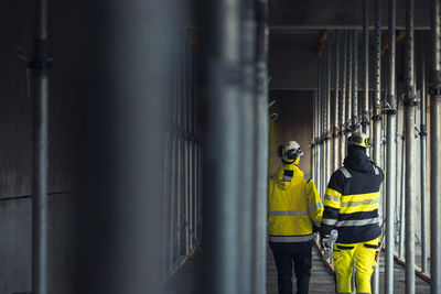 Rear view of engineers at building site