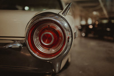 Close-up of vintage car taillight on road at night