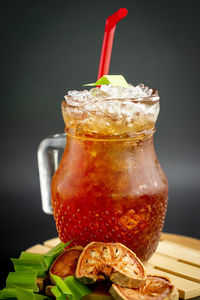 Close-up of drink in glass jar on table