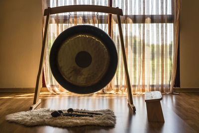 Gong with stool and mallets in studio