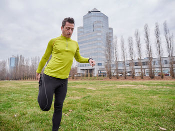 Mature man stretching at park