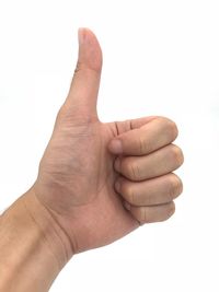 Close-up of human hand against white background