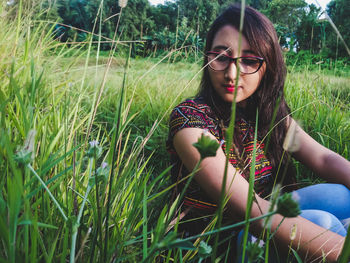 Beautiful young woman in grass