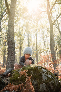 Man looking away in forest