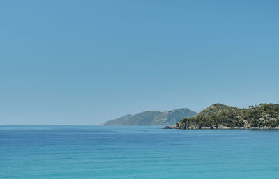 Scenic view of sea against clear blue sky