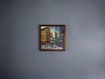 Low angle view of painting on wall against sky