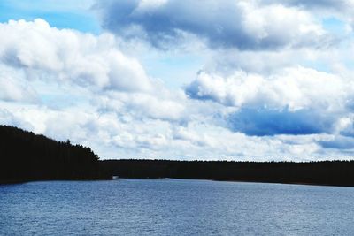 Scenic view of lake against sky during winter