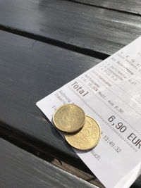 High angle view of coins on table