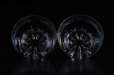 Close-up of glass bowls against black background