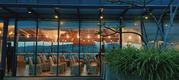 Panoramic shot of illuminated glass window at night