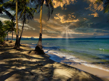 Scenic view of sea against sky at sunset
