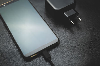 High angle view of mobile phone on table