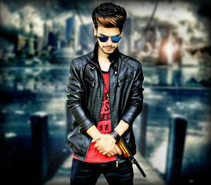 Full length of young man wearing sunglasses standing outdoors