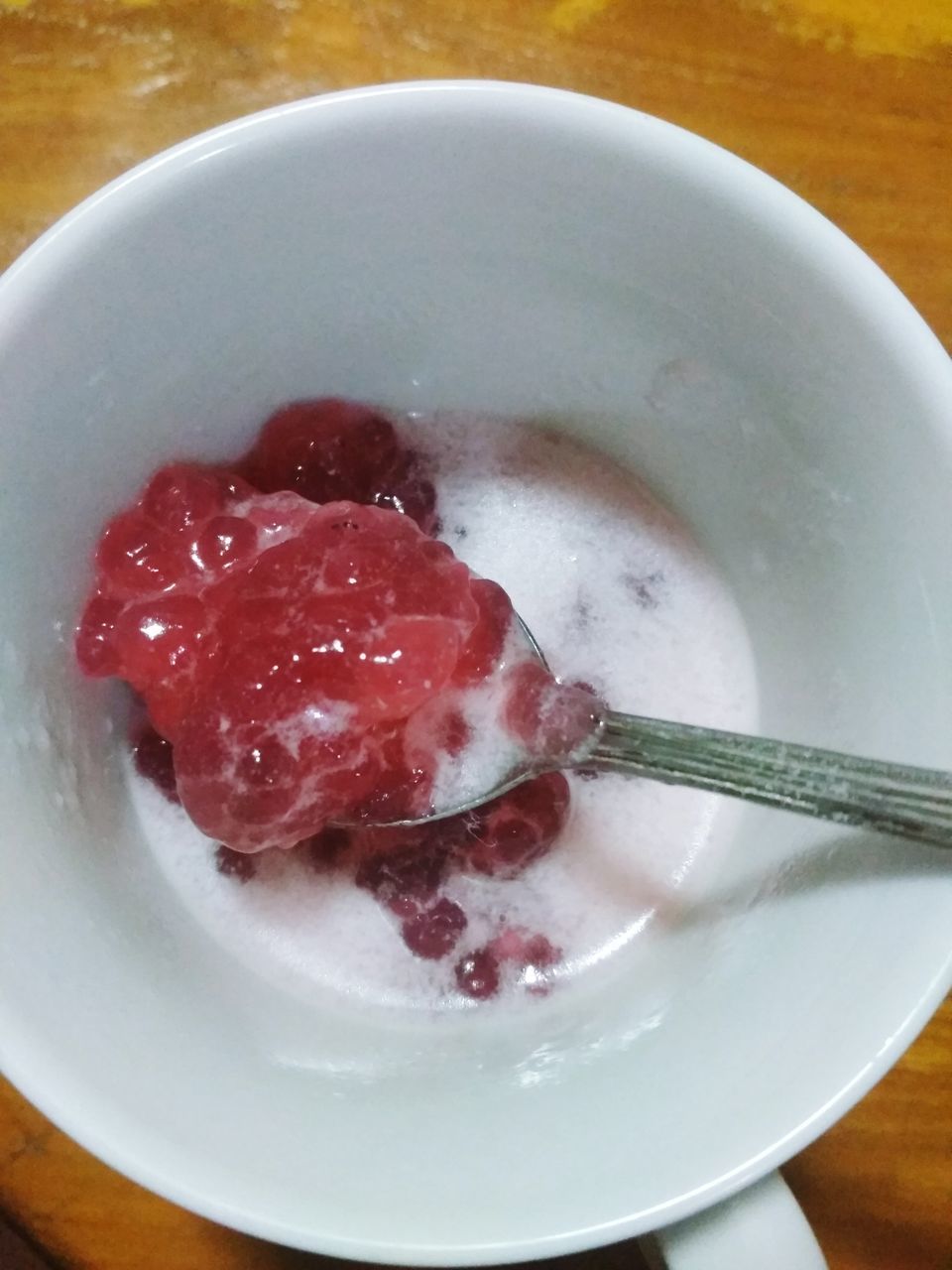 HIGH ANGLE VIEW OF BREAKFAST IN GLASS BOWL