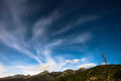 Low angle view of mountain against sky at night