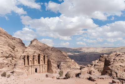 Building hewn into rocky landscape at petra in jordan