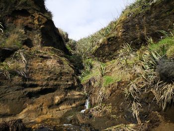 Low angle view of rocks against sky