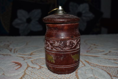 Close-up of old tea light on table