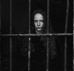 Portrait of girl in cage