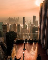 High angle view of buildings against sky during sunset