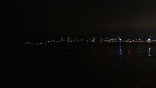 Illuminated buildings in city at night